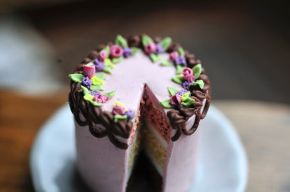 Pink Floral cake w/ choc piping & slice